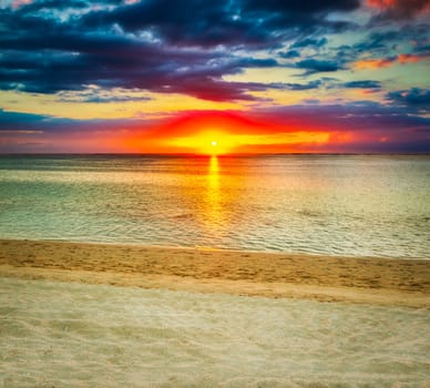 White sandy beach Le Morn  at sunset. Mauritius.