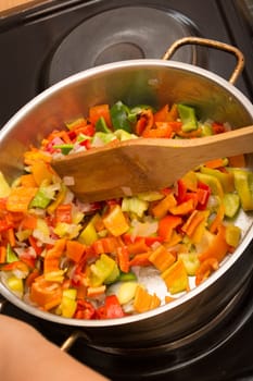 Cooking stew with fresh vegetables in a pot
