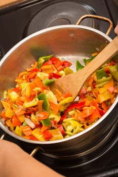 Cooking stew with fresh vegetables in a pot