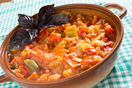 Closeup of delicious stew with mixed vegetables, arranged with purple leaves