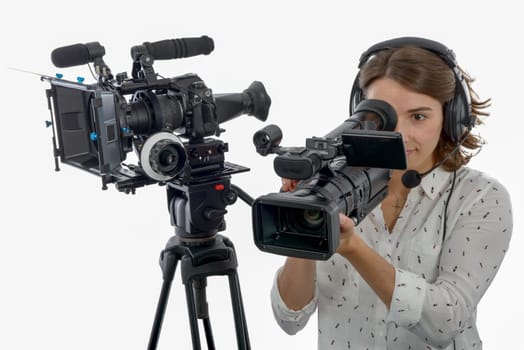 pretty young  girl with a professional camcorder, on white