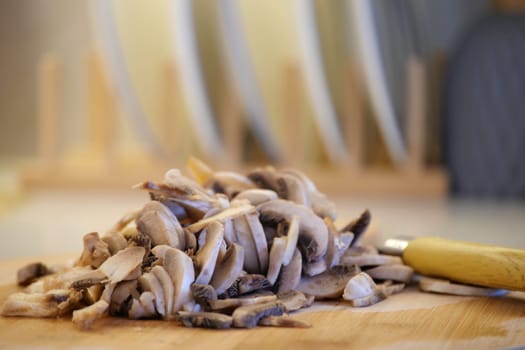 Fresh mushrooms are sliced and ready for a delicious meal preparation.