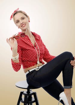 beautiful blond smiling woman in retro style