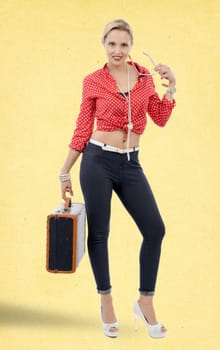 beautiful blond smiling woman in retro style with suitcase