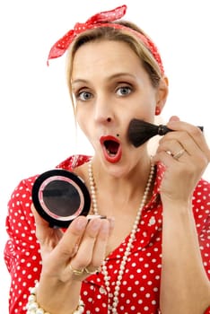 pretty blond pin up girl applying blusher isolated on white background
