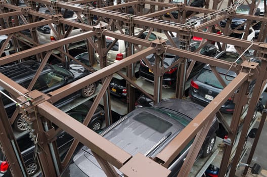 NEW YORK CITY - MAY 1, 2016: Due to lack of space cars are parked on elevated parking places in Chelsea, a neighbourhood in Manhattan