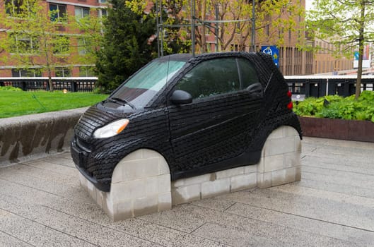 NEW YORK CITY - MAY 1, 2016: contemporary public art of a small car at the High Line Park in new york