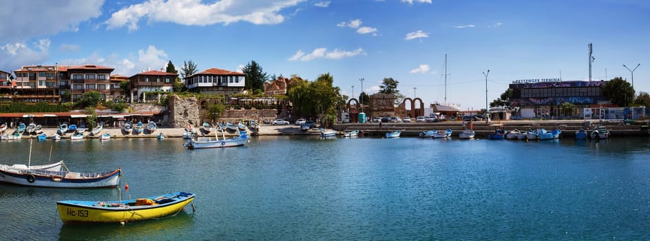 Nesebar, Bulgaria, September 06, 2013: Fishing boats in the harbor of the old town of Nessebar, Bulgaria. Old Nesebar is an ancient town on the Bulgarian Black Sea coast. Panoramic shot.