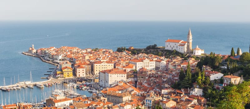 Picturesque old town Piran on Slovenian adriatic coast in afternoon sun.