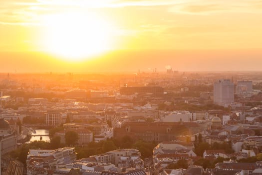 Beautiful panoramic aerial view over Berlin, Germany, in romantic colorful sunset.