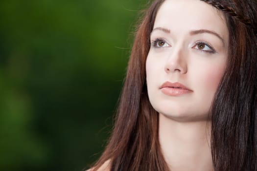 Young beauty woman in the forest whith beautiful looks