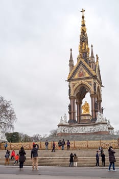 LONDON, UK - DECEMBER 17: Tourists taking pictures in front of the Albert Memorial in Kensington Gardens. December 17, 2014 in London.