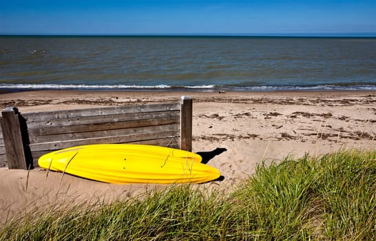 Yellow Kayak on shore on Lake Huron Ontario