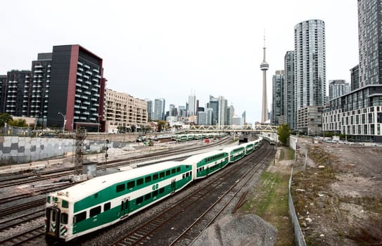 Daytime Photos of Toronto Ontario buildings downtown go train and tracks