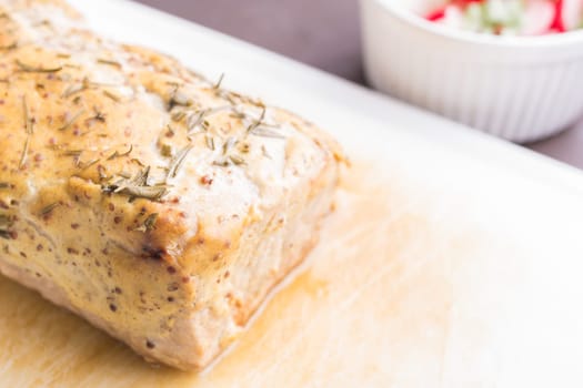 Fried roast pork with mustard crust and rosemary