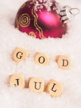 Scandinavian Christmas with the words God Jul, Merry Christmas background with selective focus on foreground