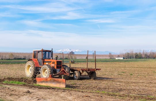 Agricultural Landscape with tractor and agricultural tools