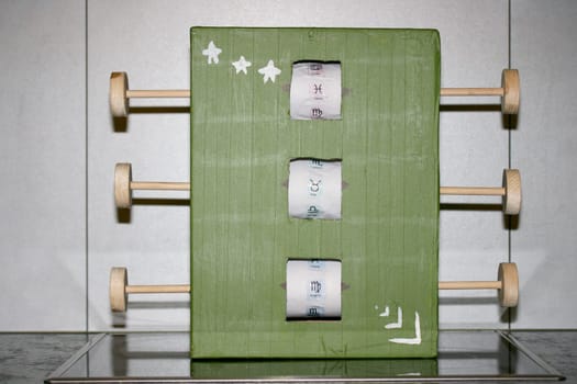 Slot machine made of wood and cardboard.