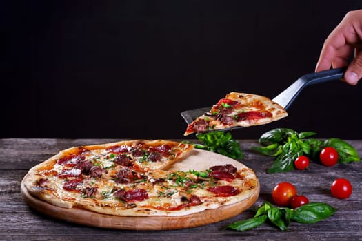 Pepperoni Pizza with salami, mushrooms , meat , beef, cheese and green onions on the wooden background. Top view.