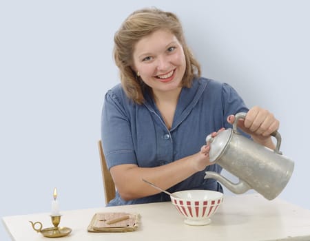 pretty woman with clothes 1940 drinking a coffee