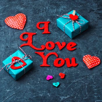 Valentines wrapped gift on slate backgrounds with the inscription I love you