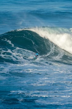 NAZARE, PORTUGAL - DECEMBER 20, 2016: Grant Baker (ZAF) during the Nazare Challenge 2016 - Big Wave Tour #3 at Praia do Norte - Nazare, Portugal.