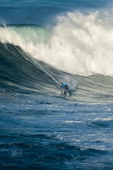 NAZARE, PORTUGAL - DECEMBER 20, 2016: Grant Baker (ZAF) during the Nazare Challenge 2016 - Big Wave Tour #3 at Praia do Norte - Nazare, Portugal.