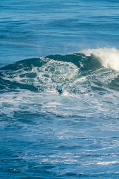 NAZARE, PORTUGAL - DECEMBER 20, 2016: Grant Baker (ZAF) during the Nazare Challenge 2016 - Big Wave Tour #3 at Praia do Norte - Nazare, Portugal.