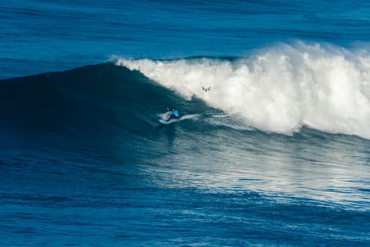 NAZARE, PORTUGAL - DECEMBER 20, 2016: Grant Baker (ZAF) during the Nazare Challenge 2016 - Big Wave Tour #3 at Praia do Norte - Nazare, Portugal.