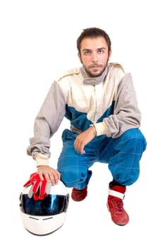 Racing driver posing with helmet isolated in white