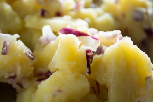 Potato salad with onions  (Selective Focus, Focus one third into the bowl)