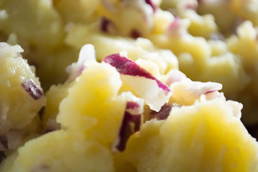Potato salad with onions  (Selective Focus, Focus one third into the bowl)
