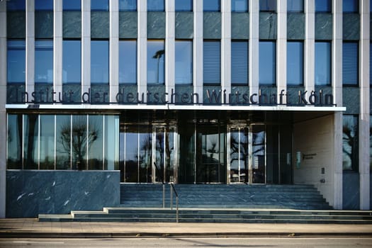 Cologne,Germany - November 24,2016: The façade and entrance of the Institute of The German Economy with logo and glass reshoot doors on November 24,2016 in Cologne.