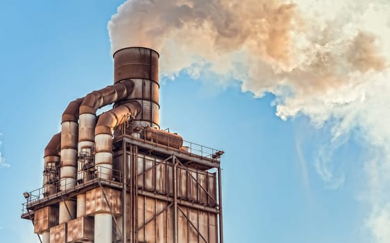 Pollution. Smoke from industrial chimney. Old smokestack of factory.