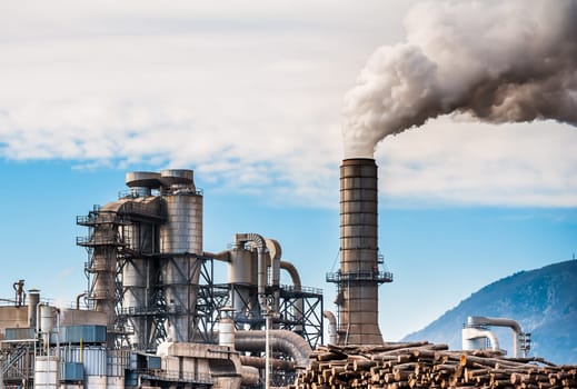 Chemical plant for the processing of chipboard and smokestack of a furniture factory