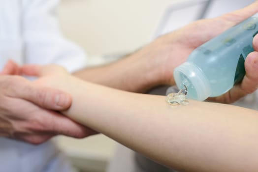 Gel being applied to patient's arm