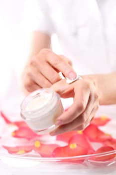 Cosmetic procedure,hand scrub. Beauty salon,manicure with hand scrub Jar with a cosmetic preparation spa & wellness. Massage of women's hands with spa peeling preparation & wellness