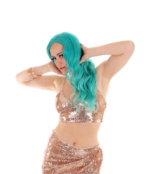 A gorgeous young woman in an gold colored outfit and long blue hair.standing, isolated for white background..