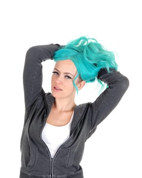 A pretty woman standing isolated for white background.with long blue hair and messing it up..