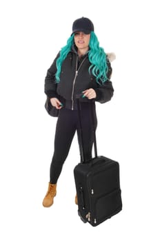 A young woman warm dressed for winter going with her suitcase on.a trip, isolated for white background..