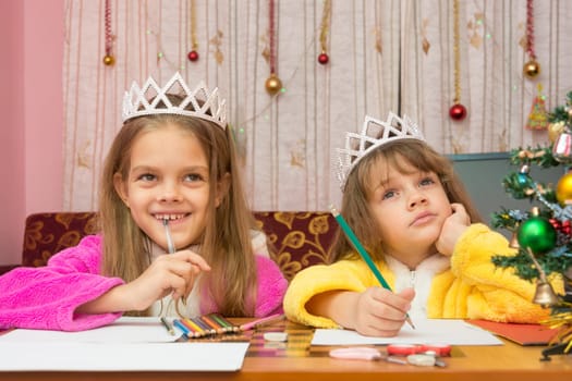 Two girls make a wish for the new year