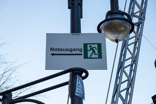 Emergency exit sign on the New Year's Eve party grounds at the Brandenburg Gate in Berlin on 30.12.2016