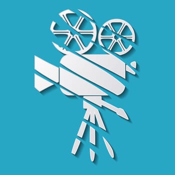 White movie camera with shadow on blue background