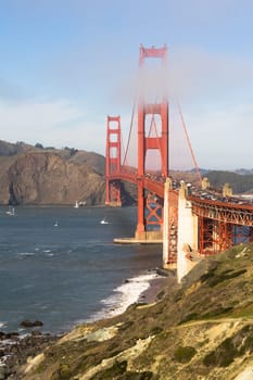 Travelers go on, under, and over the Golden Gate Bridge in San Francisco
