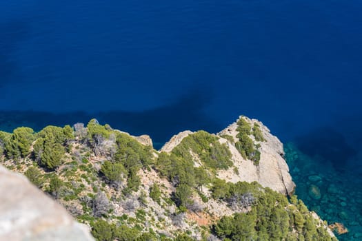 Sea waves and rocks on the steep west coast of Mallorca. .