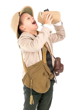 Young boy with canteen playing Safari isolated in white