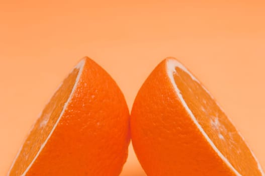 Orange pattern on orange colored background citrus arrangement