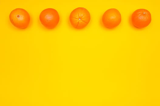 Orange pattern on orange colored background citrus arrangement