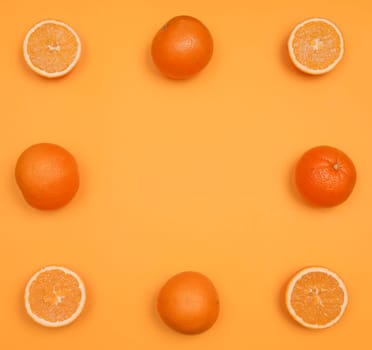 Orange pattern on orange colored background citrus arrangement