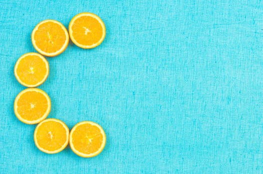 Orange and lemon citrus fruit pattern on light blue background